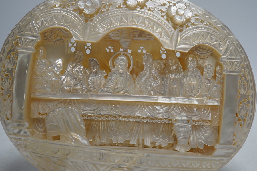 A mother of pearl carved scene of The Last Supper, on easel, 18cm wide. Condition - good